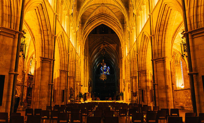 The interior of southwark cathedral during a candlelight concert, home of one of the best carol concerts in London