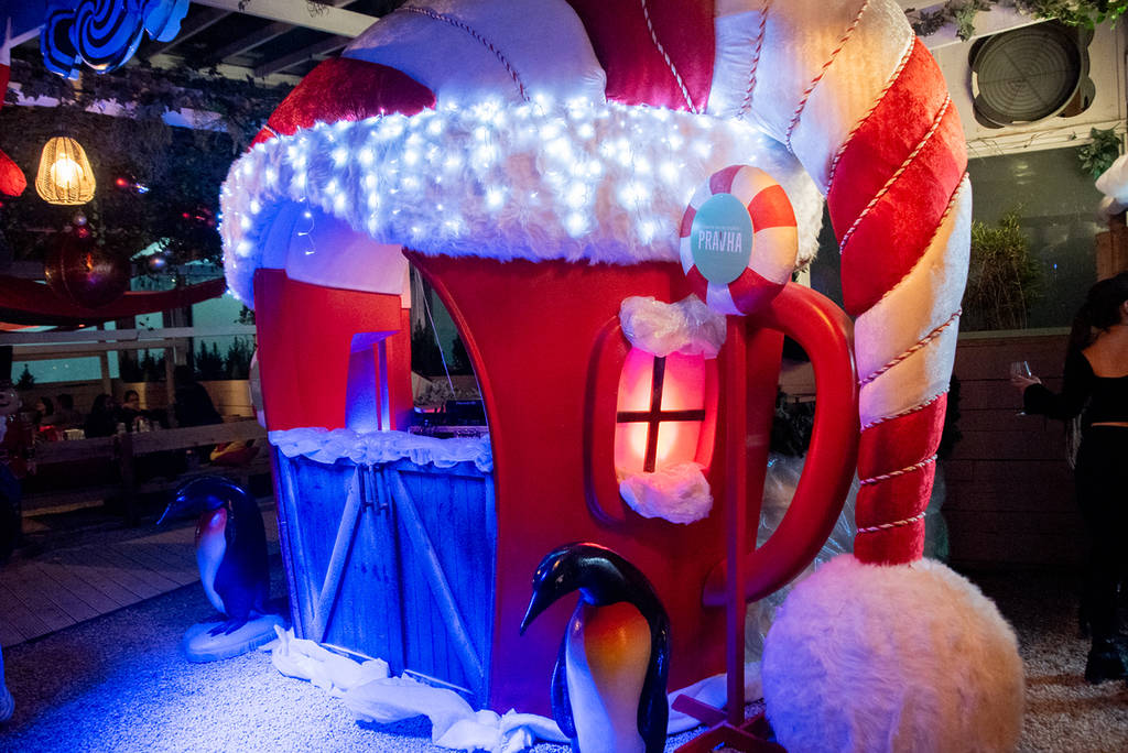 a christmassy stall at pergola paddington lit up with fairy lights