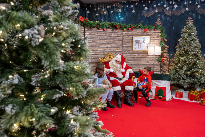 Santa at his grotto in Ealing Broadway shopping centre, one of the best Santa's grottos in London