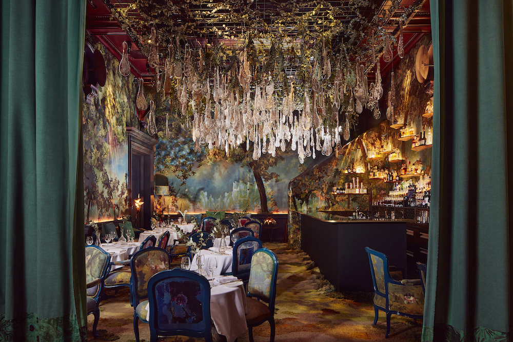 the incredibly lush glade dining room at sketch, with an ornate glass chandelier