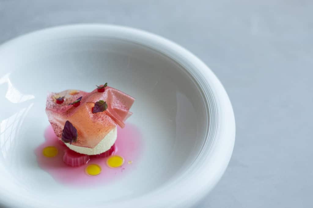 a dish from da terra, with plenty of pink on a pristine white bowl