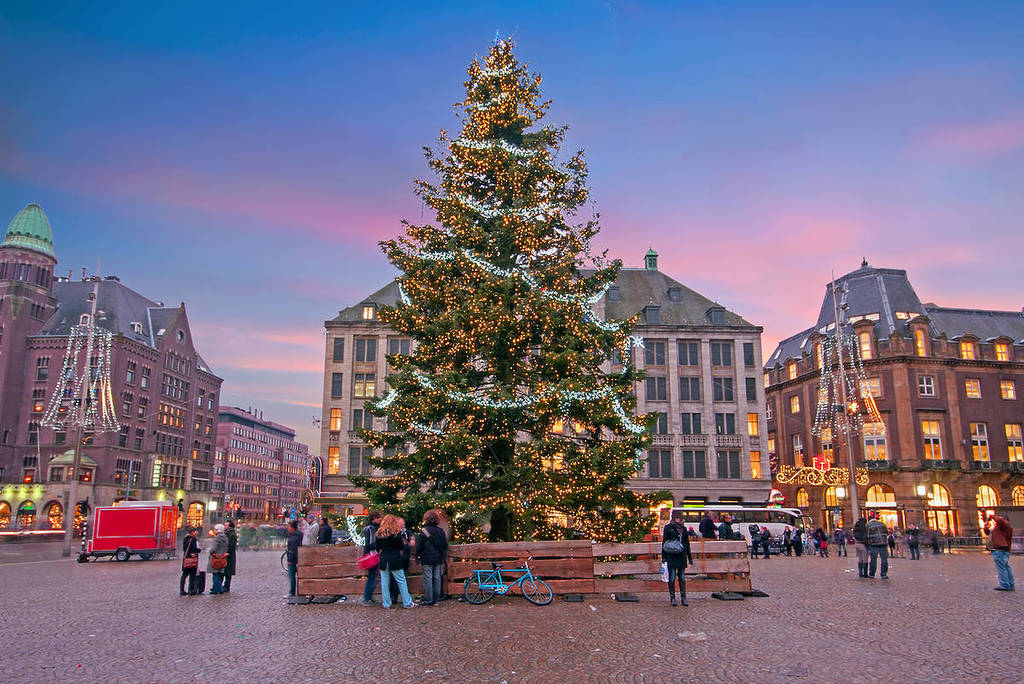 Amsterdam at christmas time on the Dam square in the Netherlands at sunset