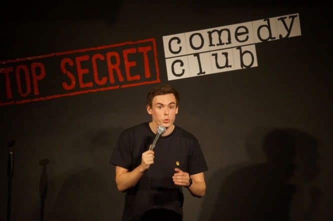 Comedian Rhys James at the Top Secret Comedy Club, one of the best things to do in London