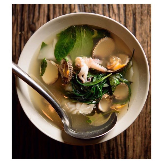 'Aeng juet ahaarn talay' - simple soup with seafood, young coconut and sea vegetables from Som Saa. 