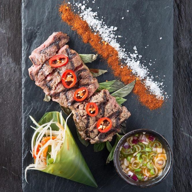 Weeping Tiger- grilled marinated sirloin of Wagyu beef served with tender stem broccoli, baby carrots and the Mango Tree signature chilli sauce. 