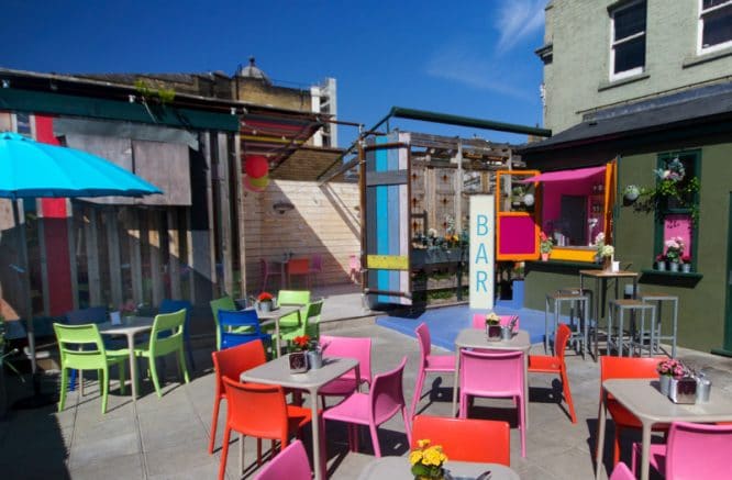 The sunny and colourful rooftop at Big Chill Bar, one of the best things to do in King's Cross