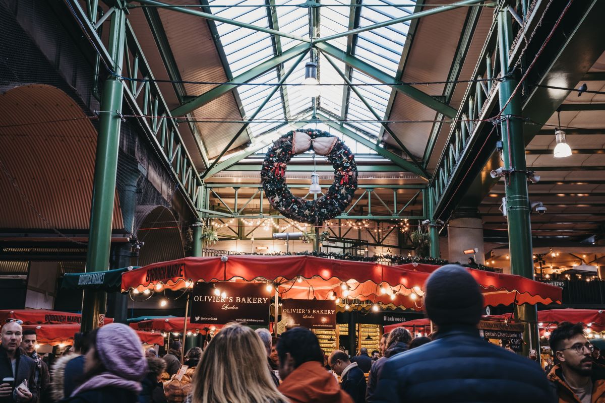 A wreath hanging above a stall at Borough Market during Christmas