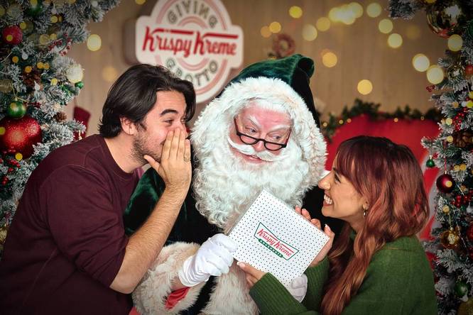 People enjoying themselves in the 'Giving Grotto' by Krispy Kreme, one of the best Santa's grottos in London this year