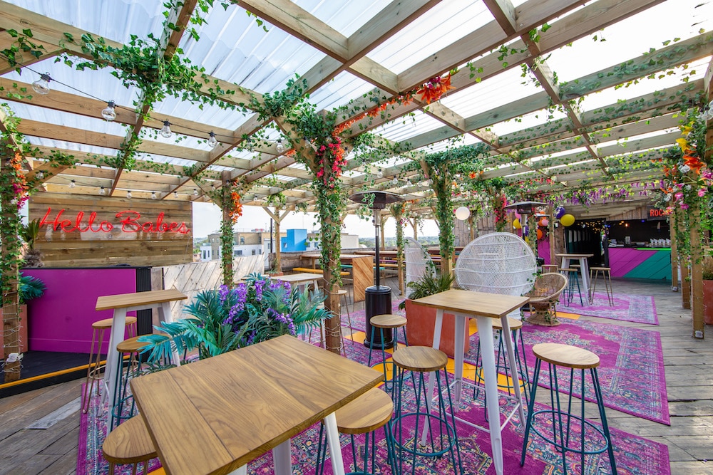 The bright and foliage-filled interior of the Bussey Rooftop Bar in Peckham 