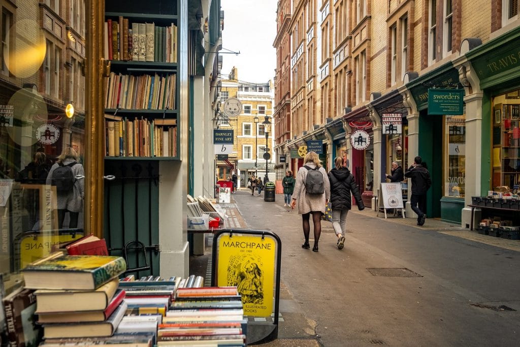 people strolling along Cecil Court, which is lined with bookstores