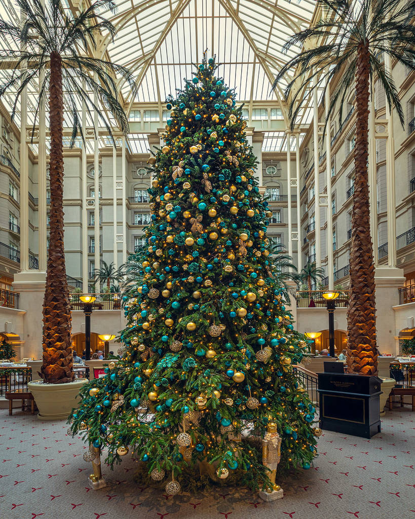 the teal and gold decorated christmas tree at the landmark london