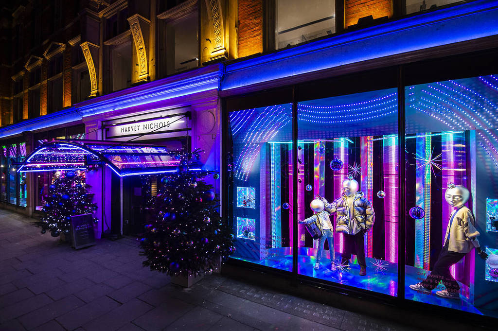 the purple and blue LED-lit christmas window displays at harvey nichols, at night