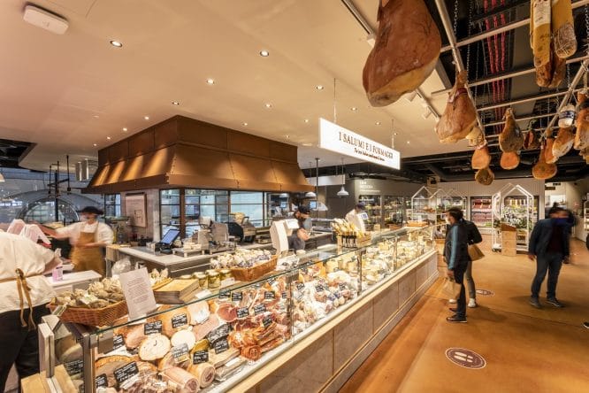 Someone looking at the cheese counter at Eataly street food market in Liverpool Street