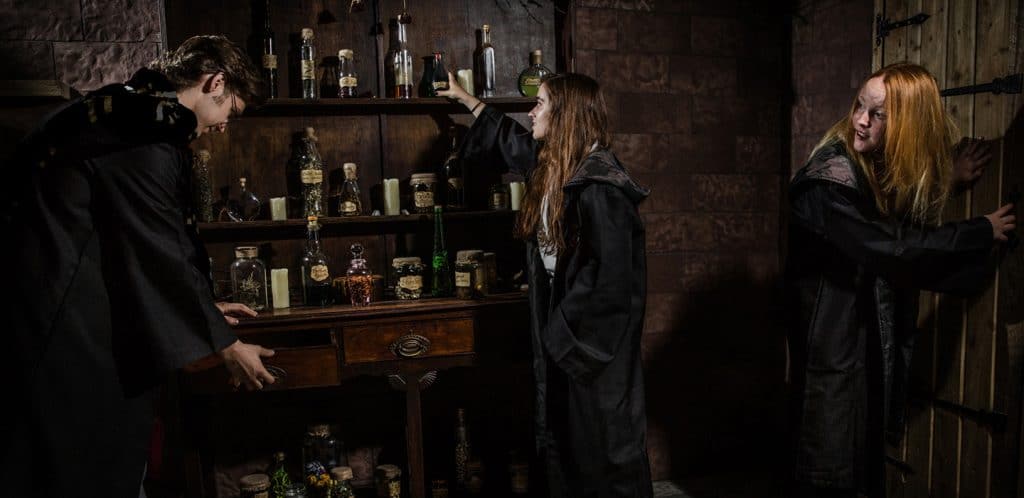 People playing the 'School of Witchcraft and Wizardry' at the Enigma Quests in London