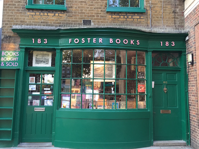 the green facade of one of london's famous bookshops, foster books