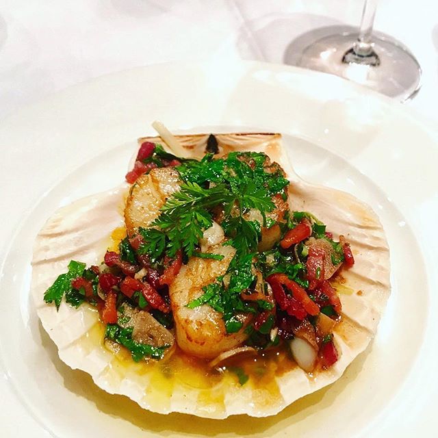 A devious scallop with all the trimmings served at L'Escargot, one of the best French restaurants in London