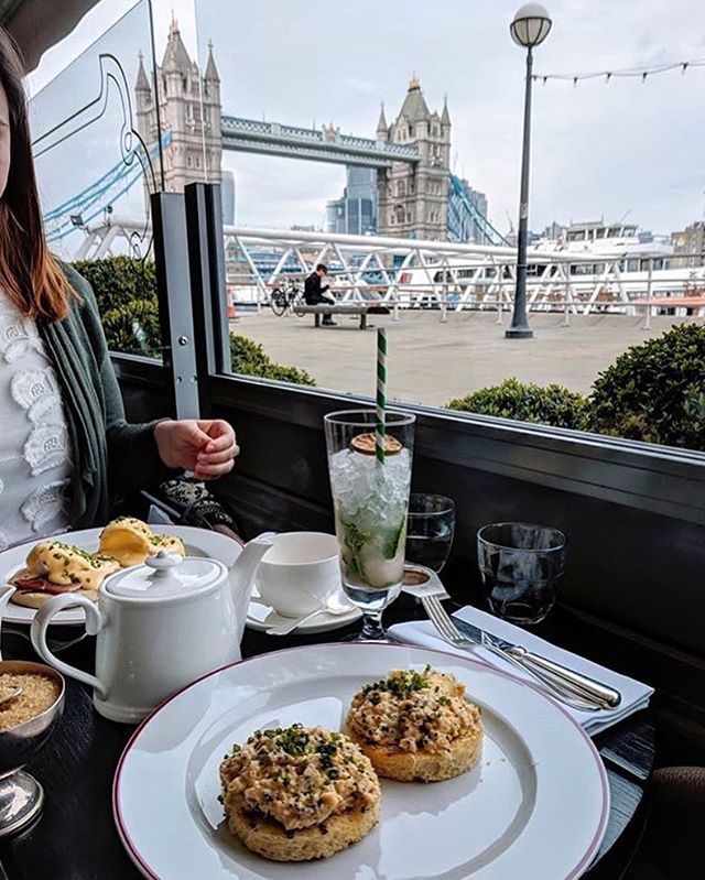 A delicious plate of food with a view of the iconic Tower Bridge at Le Pont de la Tour 