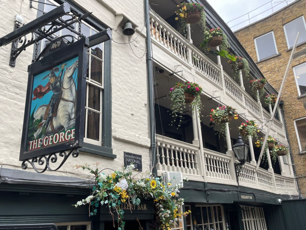 a view of the sing outside the George Pub, one of the oldest pubs in London