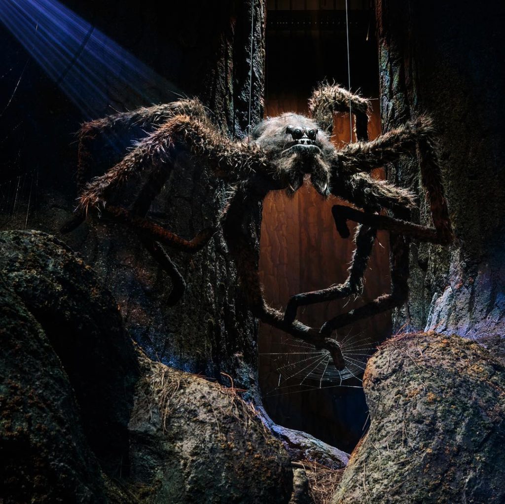 A giant spider perched above a set on the Harry Potter Studio Tour