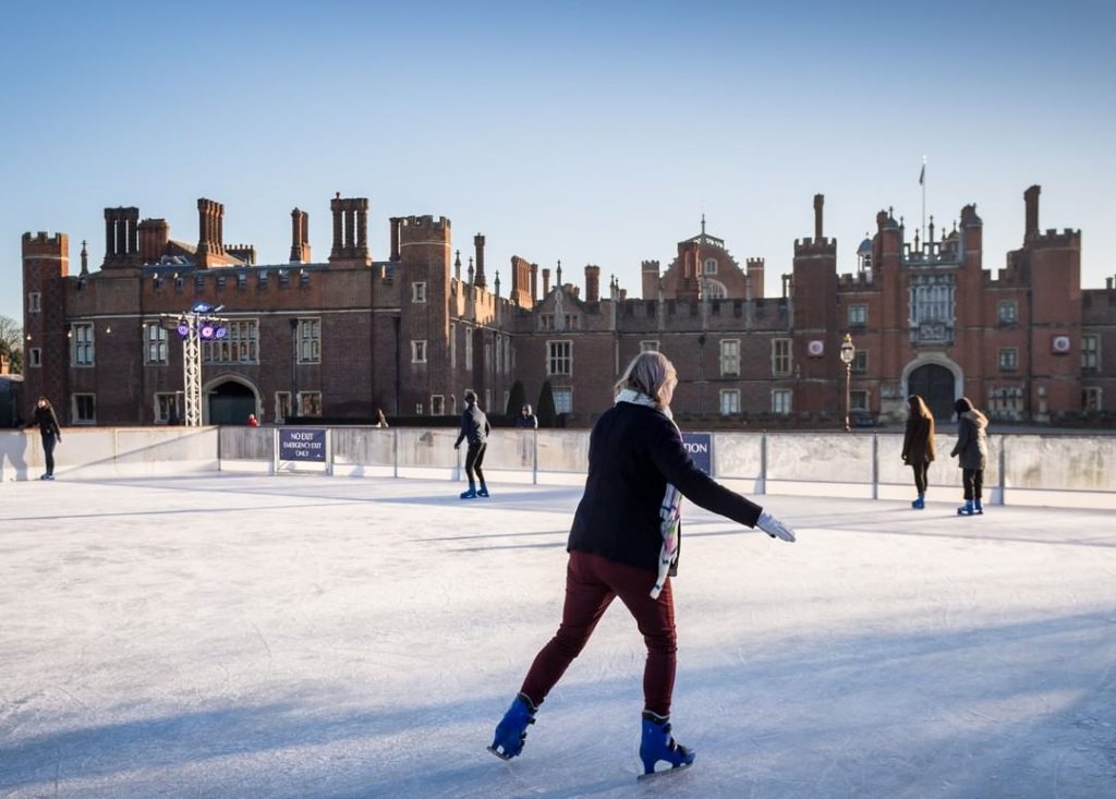 Someone skiing around the Hampton Court ice rink in West London