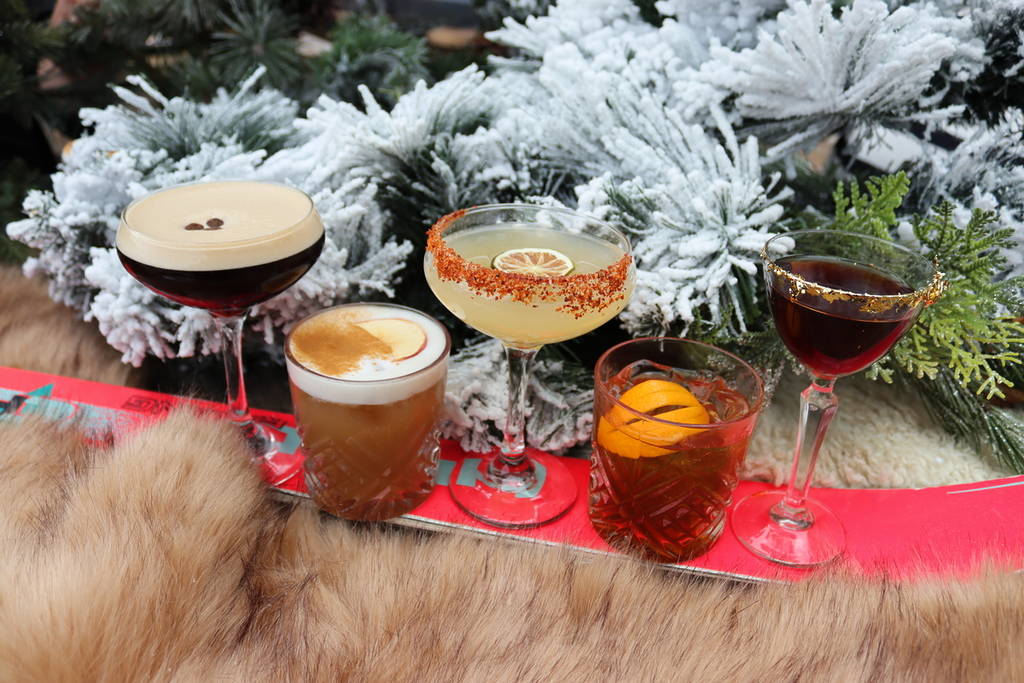 a selection of lucky club camden's winter cocktails posed on a ski