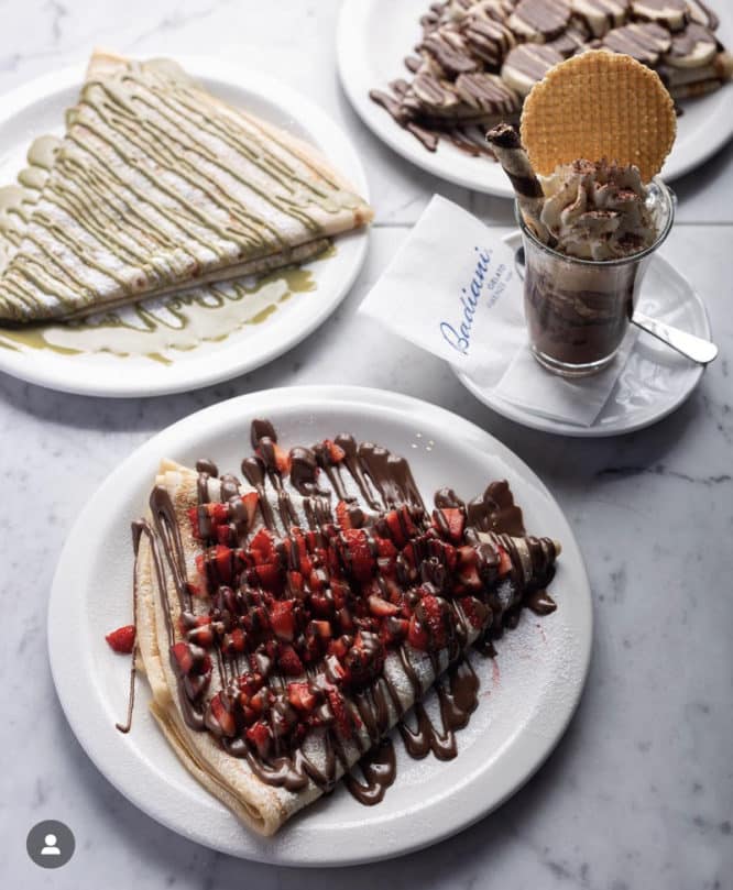 A delicious crepe drizzled in chocolate sauce with gelato on the side at Badiani Gelato 