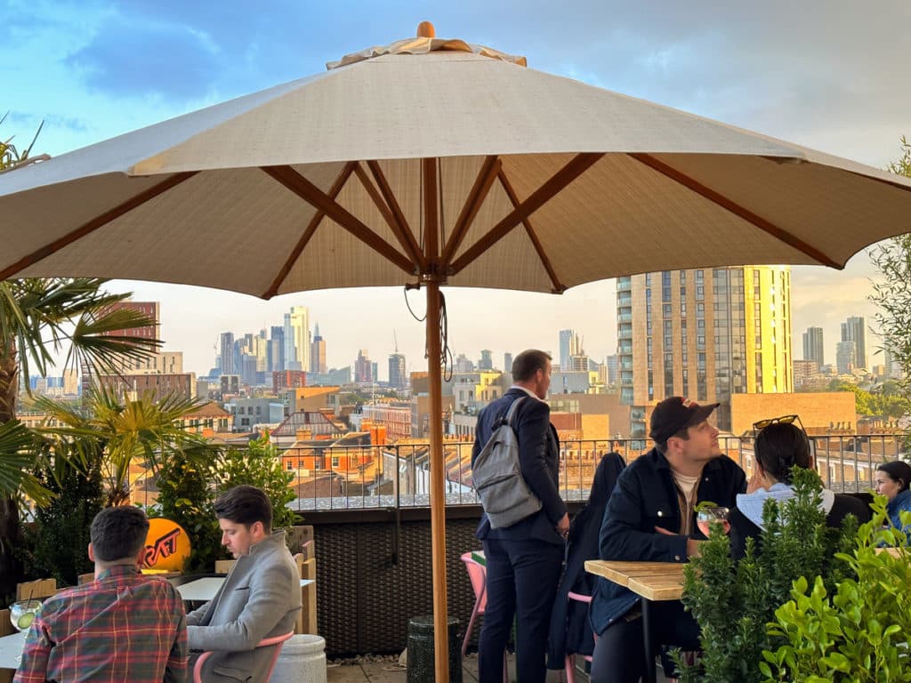 People milling about on the rooftop at KRAFT in Dalston