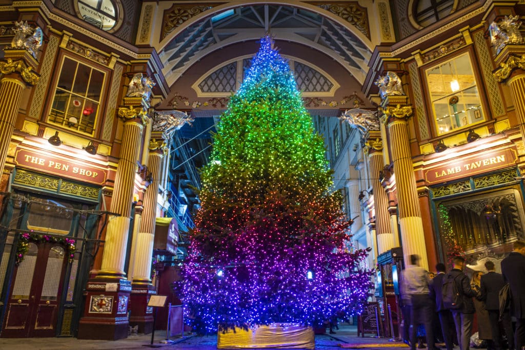 Leadenhall Market's christmas tree lit up with a rainbow of lights