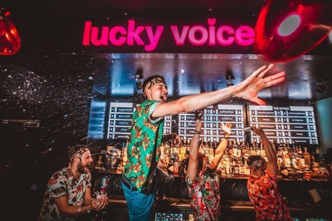 Someone singing karaoke at Lucky Voice in London