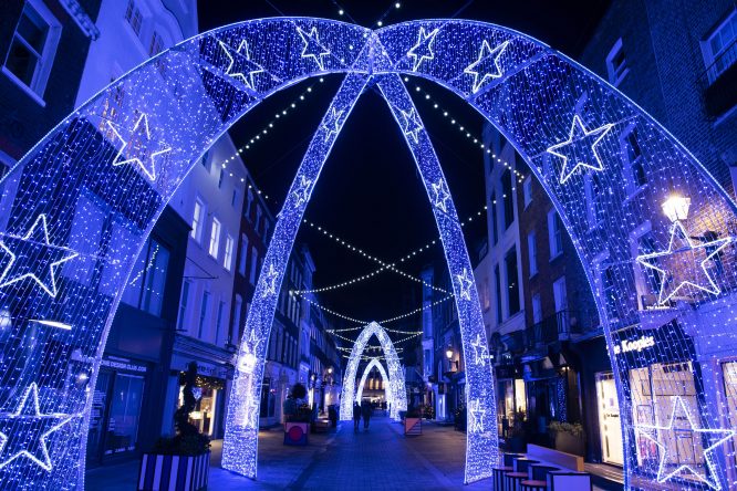 The archway lighting installations found as part of Mayfair's christmas light display, where blue-lit archways covered in stars and lights line the street