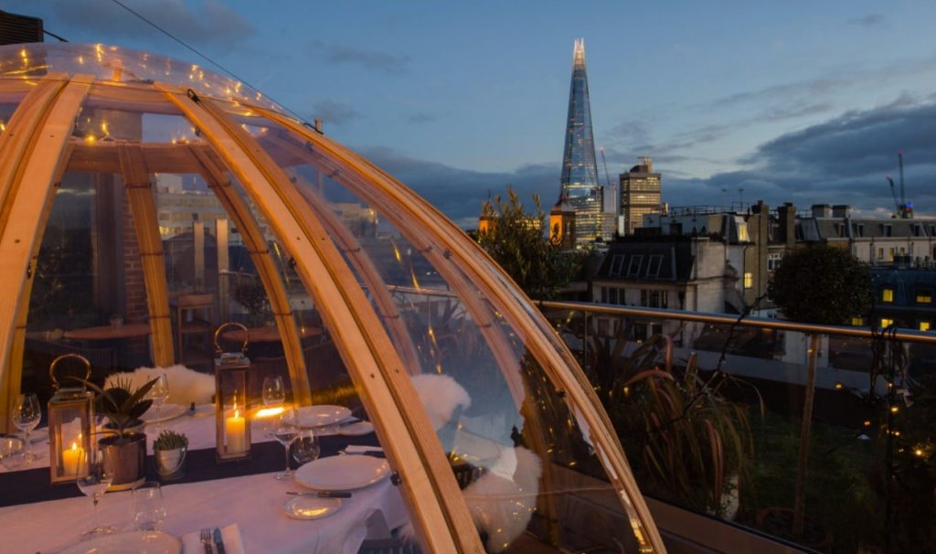 the igloo on the mercer terrace in the early evening, with the shard visible in the distance
