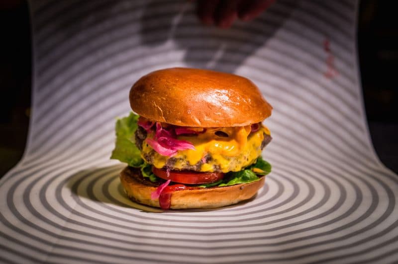 A burger with brioche bun and all the toppings at Patty and Bun in London
