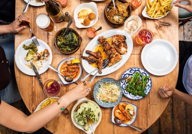 A spread of Portuguese dishes on a table at Casa Do Frango