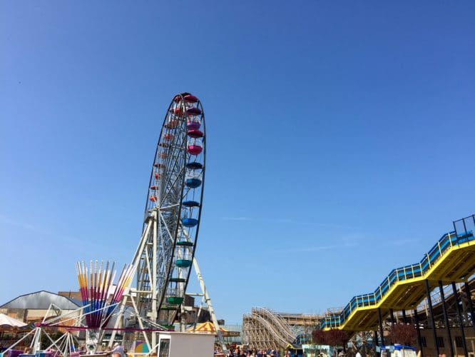 A ferris wheel and the Scenic Railway ride at Dreamland Margate, one of the best theme parks near London