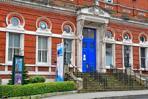 The bright blue door and exterior of Camden Arts Centre in North London