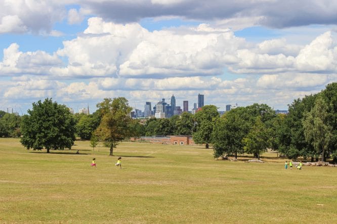 The sun shining over Brockwell Park and the London skyline 