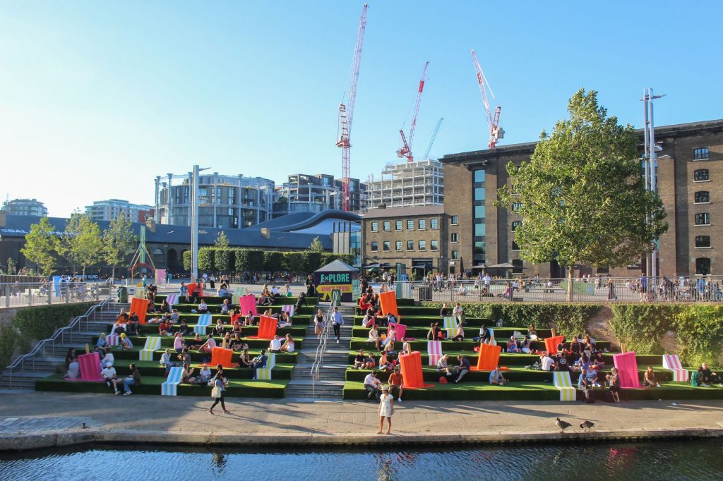 People enjoying the sunshine by the Regent's Canal in King's Cross St. Pancras