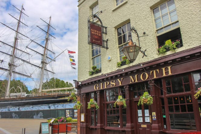 The exterior of The Gipsy Moth pub in front of the Cutty Sark in Greenwich