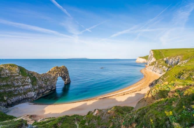 A panoramic view of Dorset's Durdle Door, one of the best beaches to visit in the UK