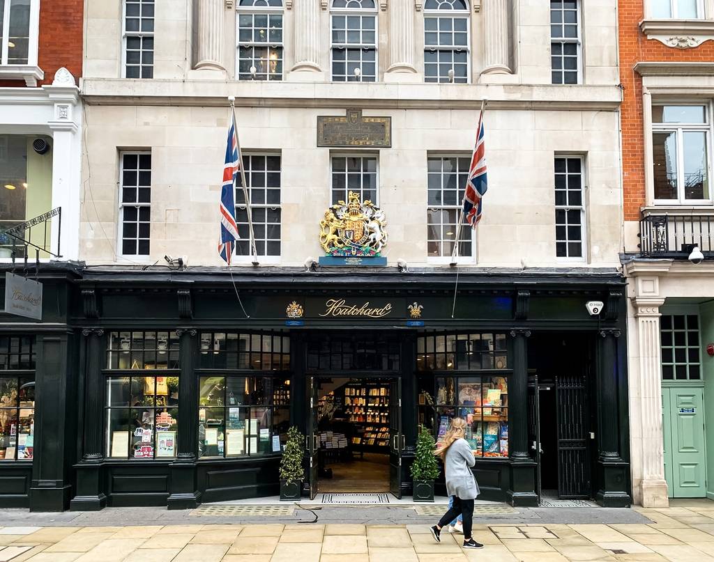 someone walking past the exterior of one of London's oldest bookstores, Hatchard's