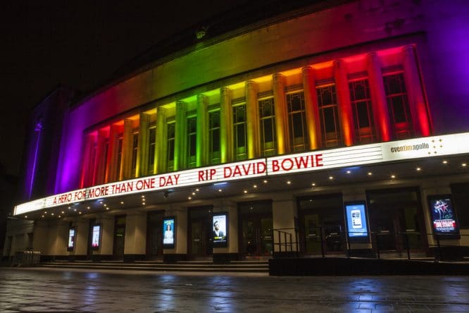 The exterior of the Eventim Apollo lit up outdoors in Hammersmith, London, one of the best music venues