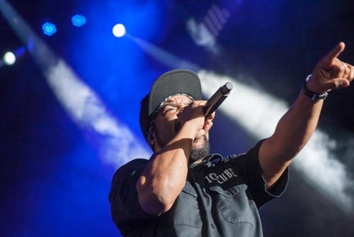 Rapper and actor Ice Cube performing to a large crowd of people at one of his gigs in London 