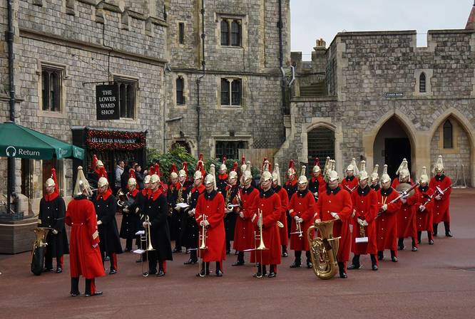 The Queen's Guards and Bands ready for a parade through the gate of Windsor Castle