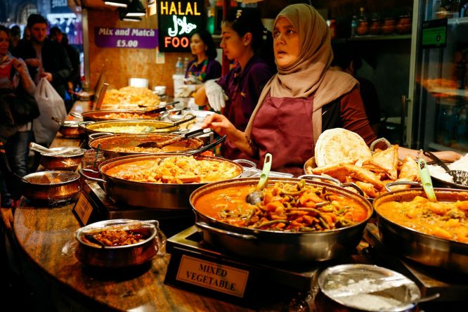 Vats of delicious and halal-prepared curries being sold at Camden Market
