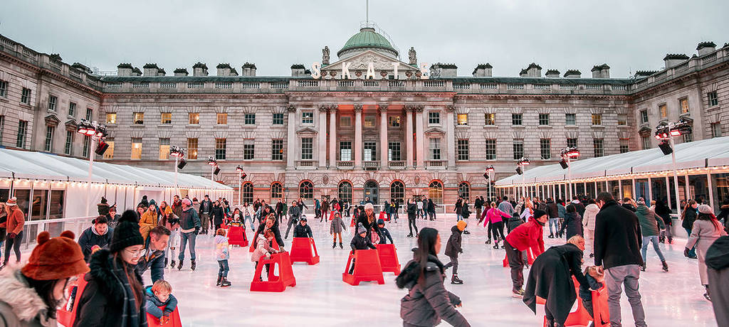 people enjoying a day out on the somerset house ice rink