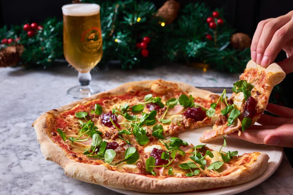 a slice of Christmas pizza at Spaghetti House