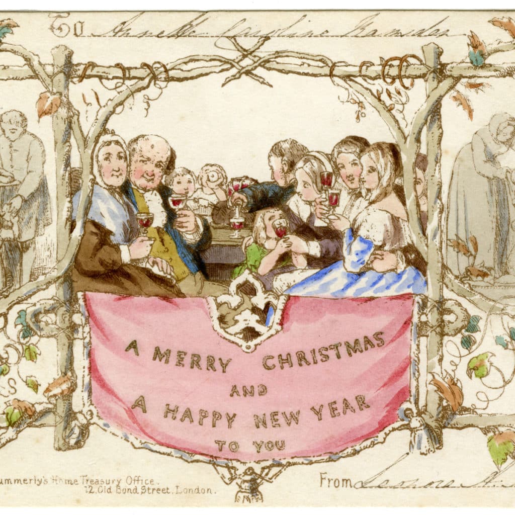 the first christmas card, which depicts a christmas lunch scene in lithograph with a banner beneath the people reading "A Merry Christmas And A Happy New Year"