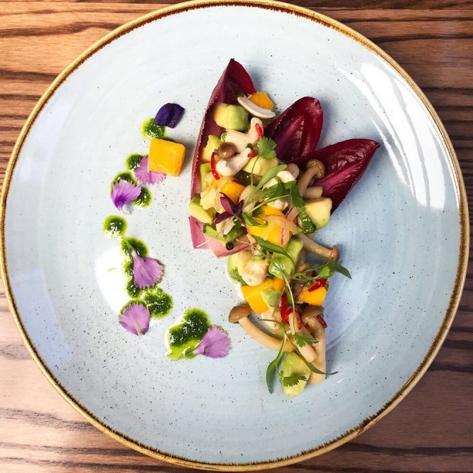 Avocado, mango and shimeji ceviche with chicory, soft cashews and a citrus and chilli dressing at one of the best vegetarian restaurants in London