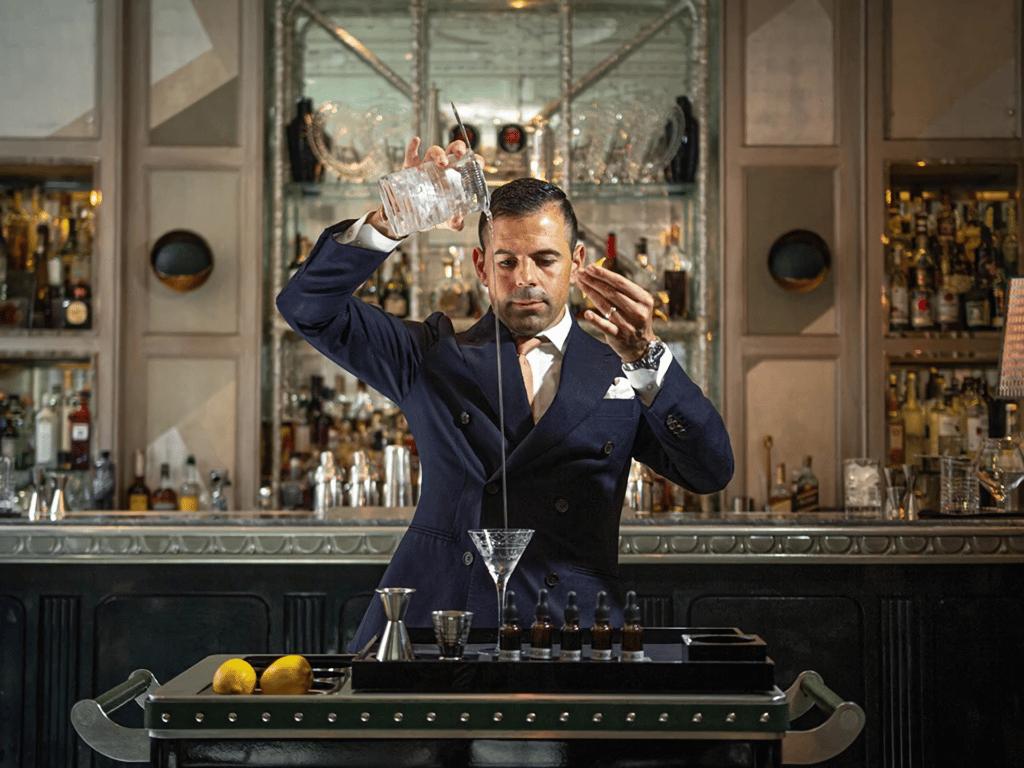 Agostino Perrone pouring a drink at the connaught bar, one of the world's 50 best bars