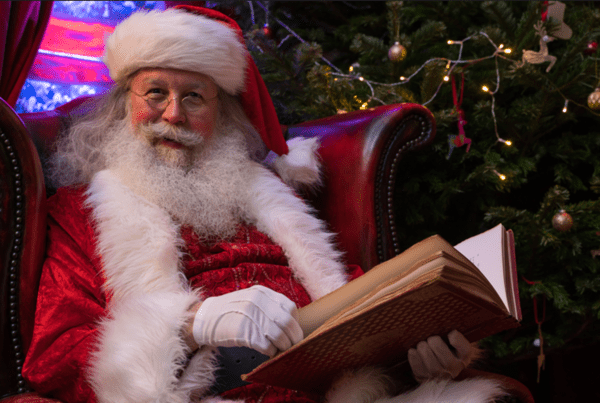 Santa Claus sat in his grotto at St. Pancras station in London 